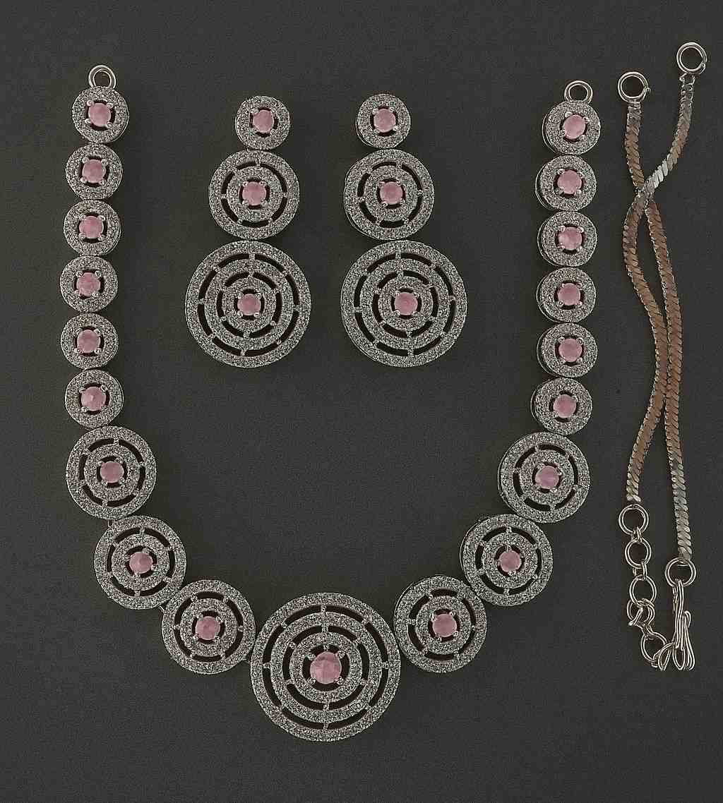 Elegant pink American diamond necklace and earrings set with circular design – party wear jewelry for women.