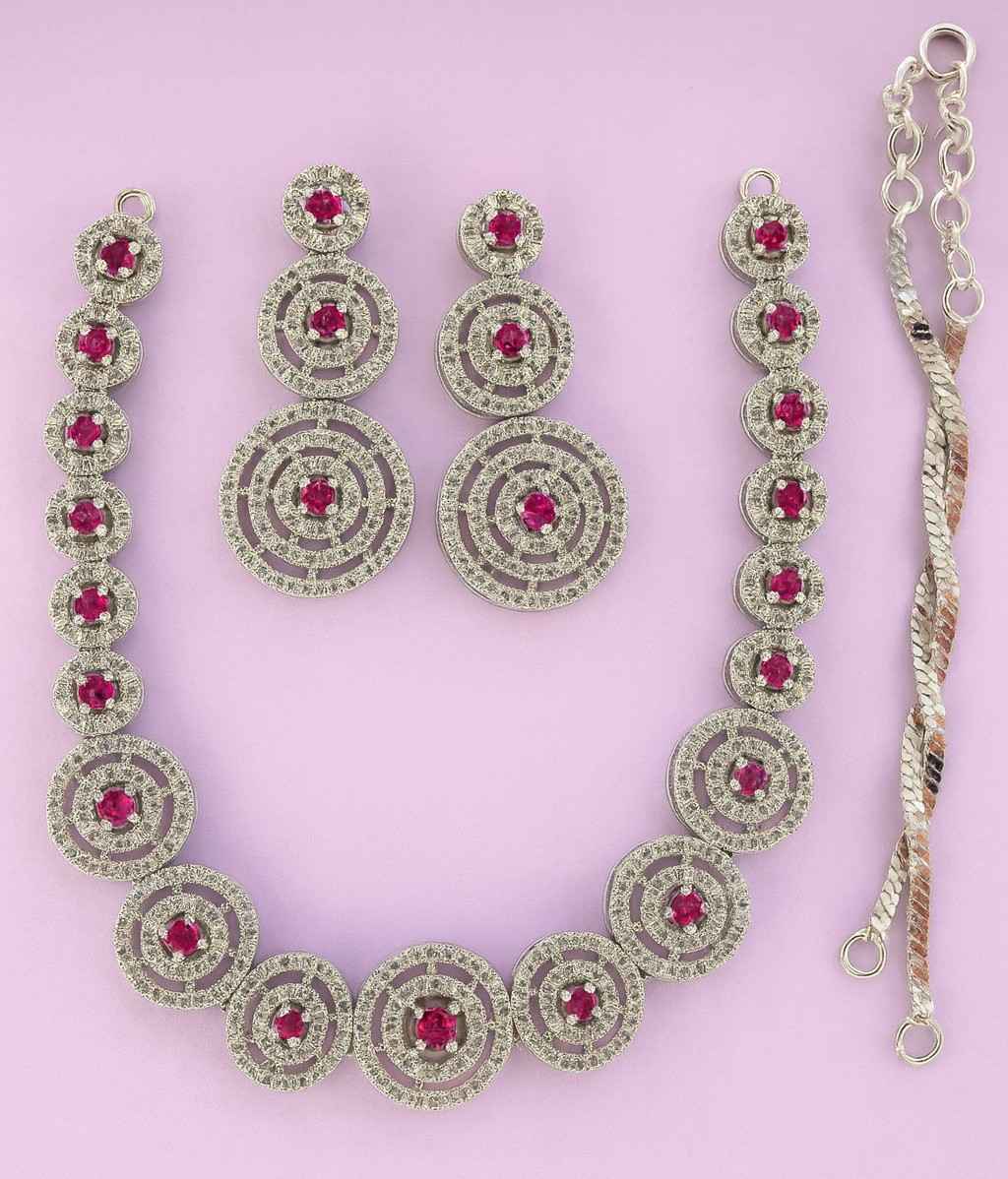 Elegant party wear necklace and earring set with red stones