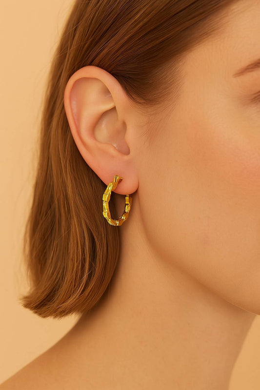 Model wearing textured gold hoop earrings – daily wear modern ethnic earrings by Suvaaura