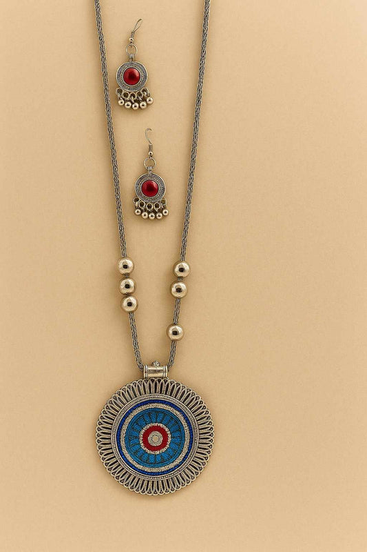 Bohemian tribal silver-tone necklace set with colorful round pendant and red stone earrings – detailed view
