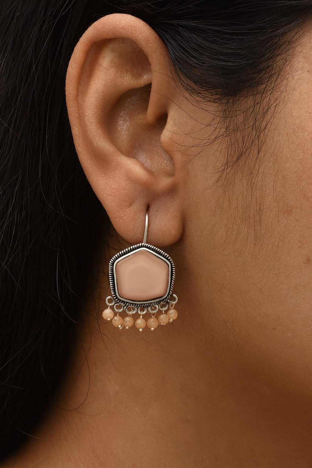 Model wearing Beige Pentagon Shape Earrings with Oxidized Detailing