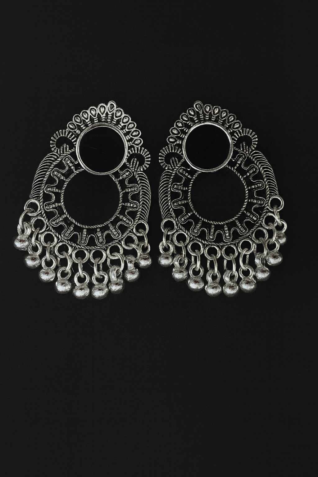 Oxidized silver-tone open hoop jhumka earrings with intricate design on black background