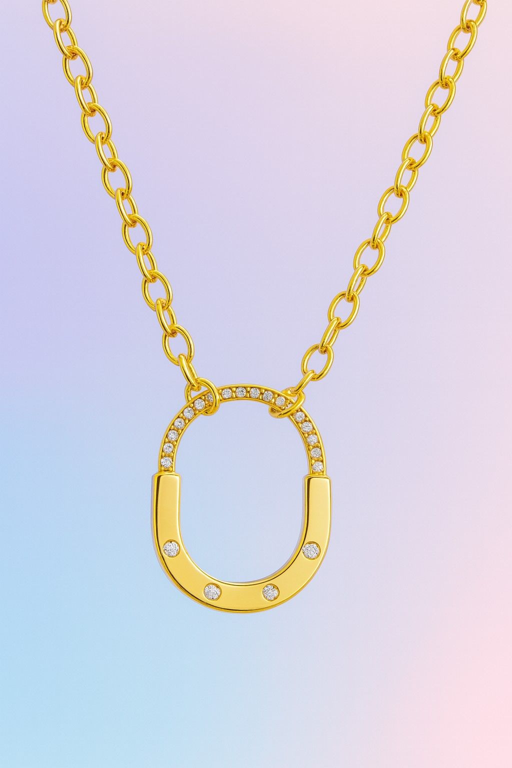 Elegant gold-tone oval pendant necklace with crystals – Suvaaura