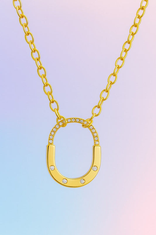 Elegant gold-tone oval pendant necklace with crystals – Suvaaura