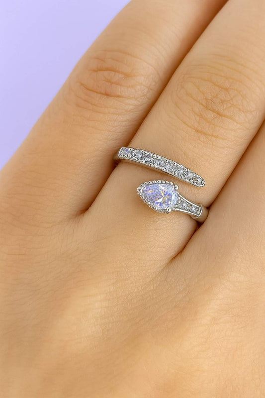 "Model wearing silver-tone teardrop crystal ring with adjustable fit"