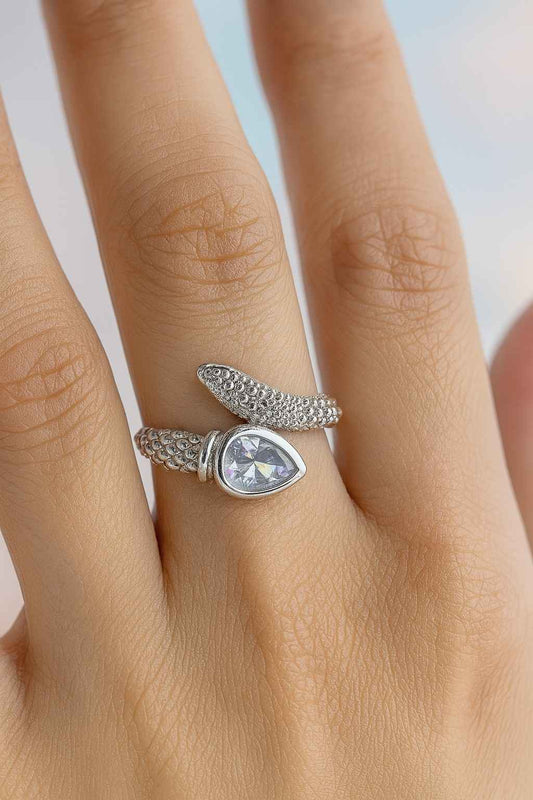 "Model wearing silver-tone textured teardrop crystal ring with adjustable fit"