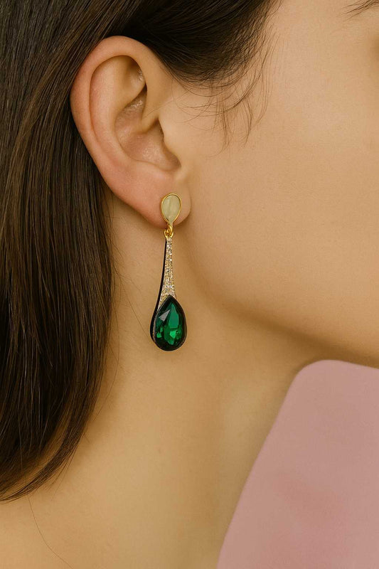 Elegant gold-tone teardrop earrings with green crystal and CZ accents – worn on ear