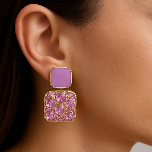 Model wearing gold-tone lilac enamel and pink crystal square drop earrings