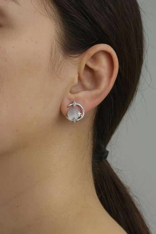 moon-star-crystal-stud-earrings-silver-tone-on-ear-model