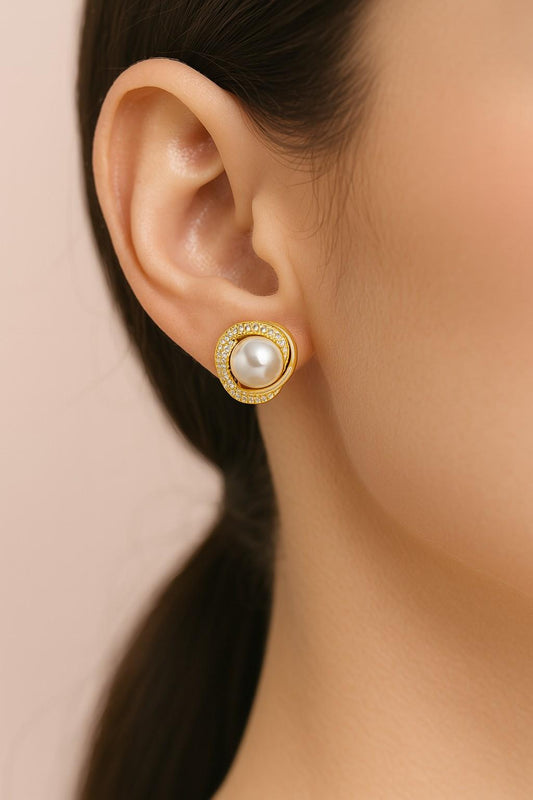Elegant golden finish pearl & crystal halo stud earrings – worn on ear