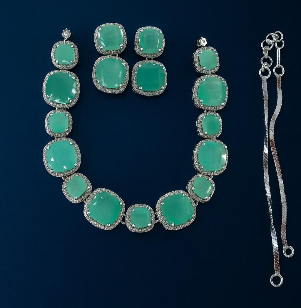 Luxury green stone necklace and earrings set with American Diamonds in silver-tone finish – bridal and party wear jewellery