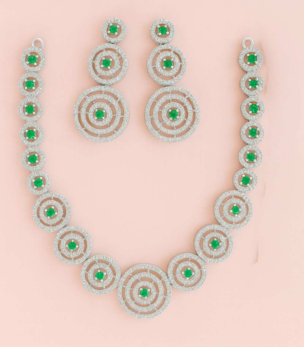 Green Stone & American Diamond Circle Necklace Set on pink background