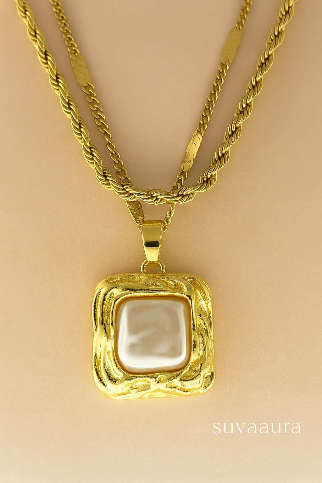 Triple-layer twisted rope gold necklace with square pearl pendant on beige background – modern Indo-western design