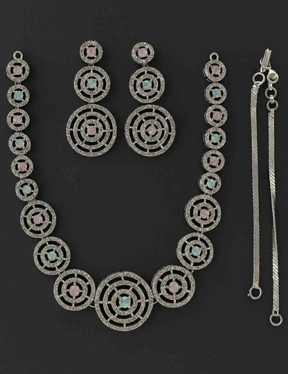 Luxury dual-tone pink and blue circular necklace set with American Diamonds in silver-tone finish, featuring matching earrings – bridal and festive wear jewelry.
