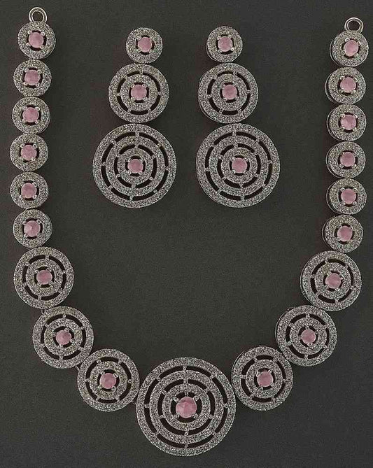 Elegant pink American diamond necklace and earrings set with circular design – party wear jewelry for women.

