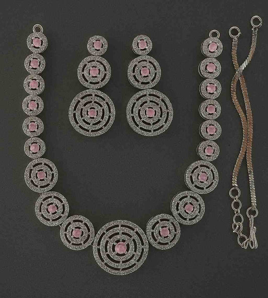 Elegant pink American diamond necklace and earrings set with circular design – party wear jewelry for women.

