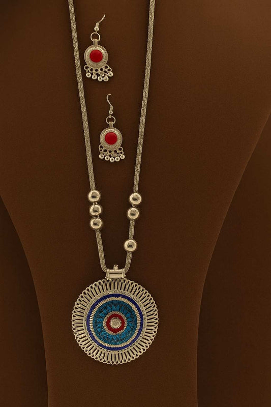 Handcrafted silver-tone long necklace with blue & red circular pendant and matching earrings – front view