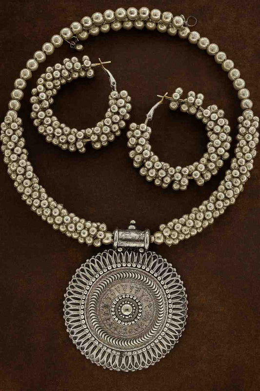 Vintage oxidized silver-tone beaded choker necklace set with large round pendant and hoop earrings