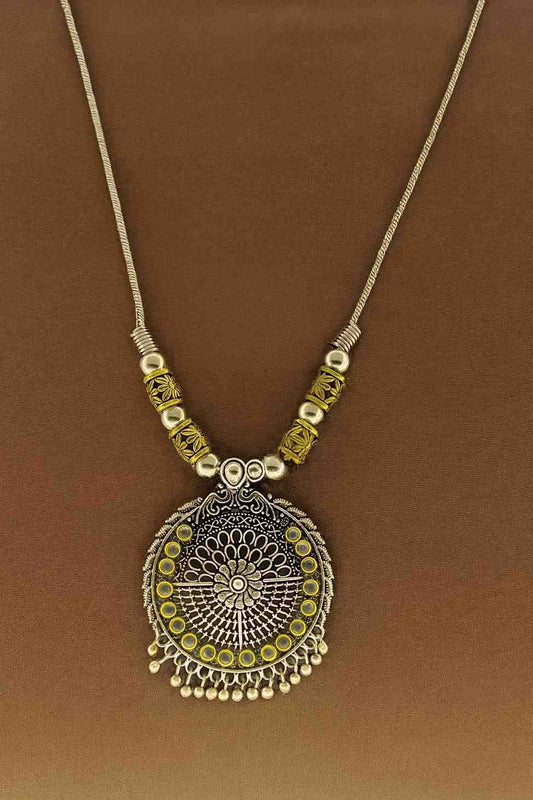 Oxidized silver and gold-tone round pendant necklace with floral mandala design – ethnic boho tribal jewelry for women.