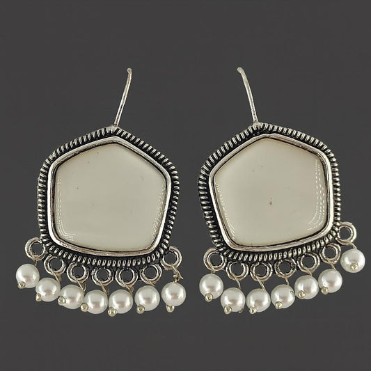 "Antique silver-plated white stone earrings with pearl beads – flat lay"