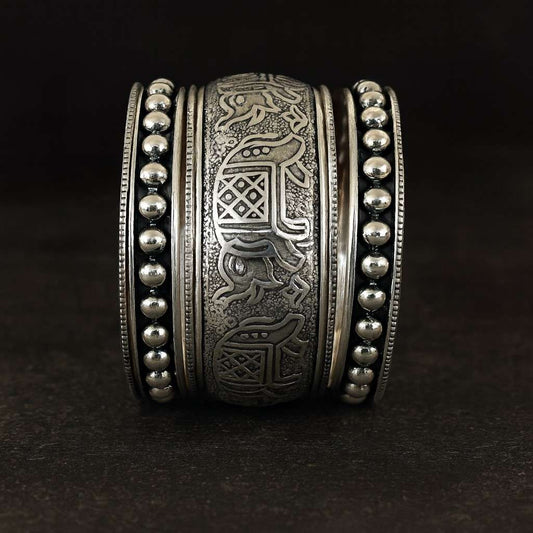 Antique elephant engraved oxidized silver-tone kada bracelet with tribal motifs – front view