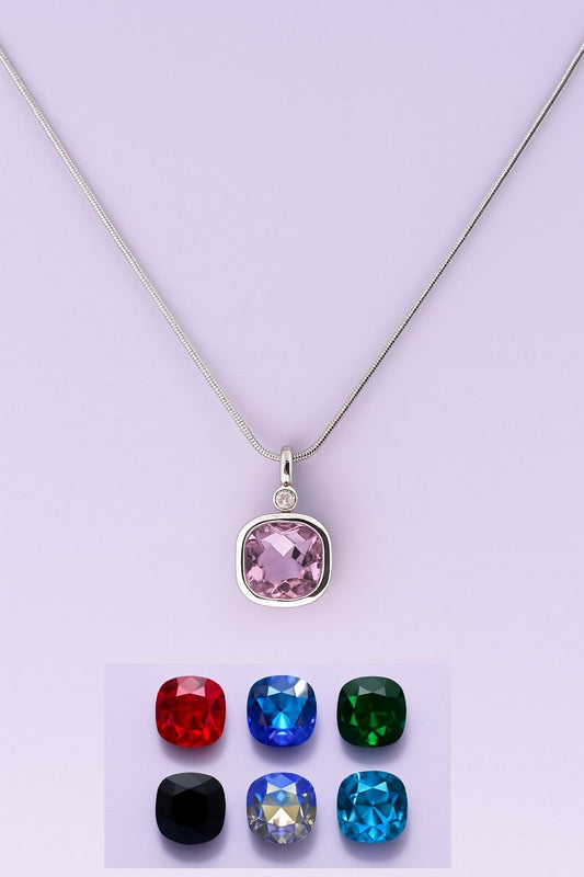 "Elegant silver-tone pendant necklace with purple crystal"