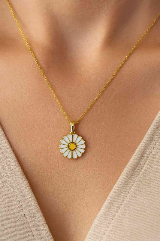 
"Model wearing gold-tone daisy flower pendant necklace – Suvaaura"