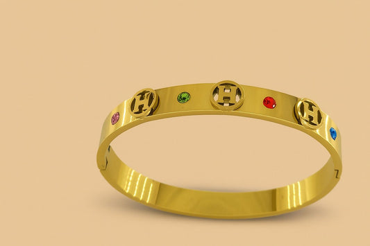 Gold-tone bracelet with multicolour crystals and cut-out design
