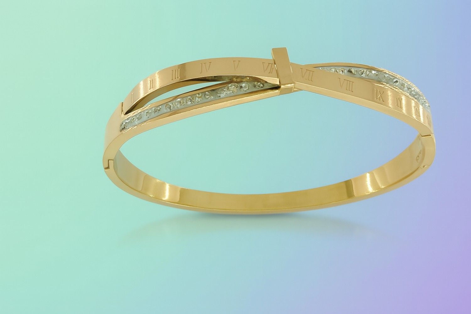Gold-tone cuff bracelet with Roman numeral engraving and crystal detailing