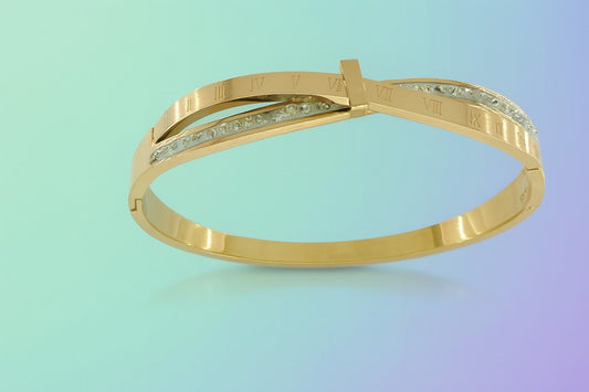 Gold-tone cuff bracelet with Roman numeral engraving and crystal detailing