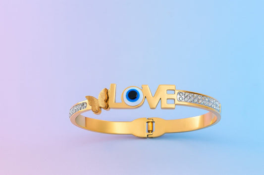 Love & butterfly gold-tone bracelet with evil eye and sparkling stones