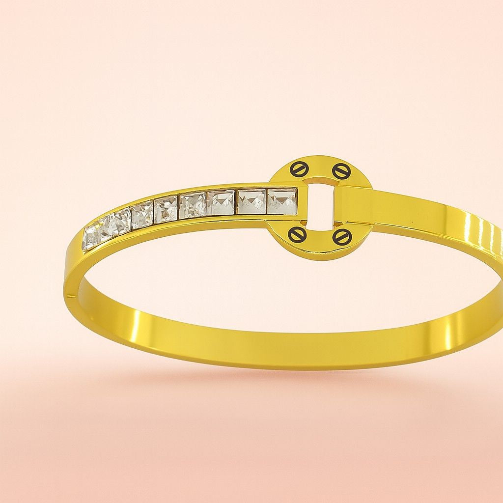 Circle motif gold-tone bracelet with square stones on pink background