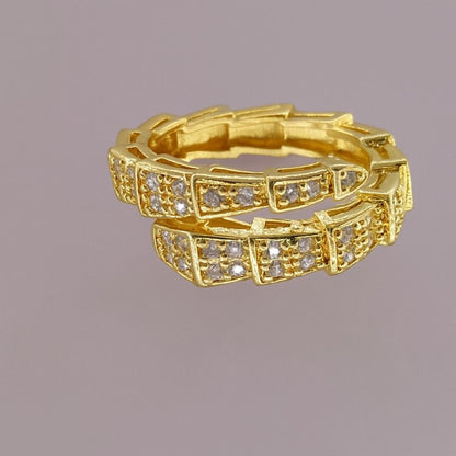 "Gold-tone double band ring with embedded sparkling crystals"