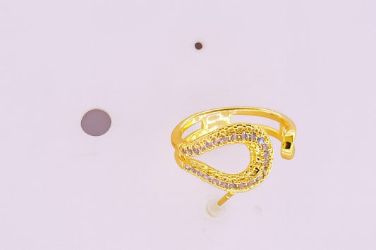 "Gold-tone open teardrop ring with embedded sparkling crystals"