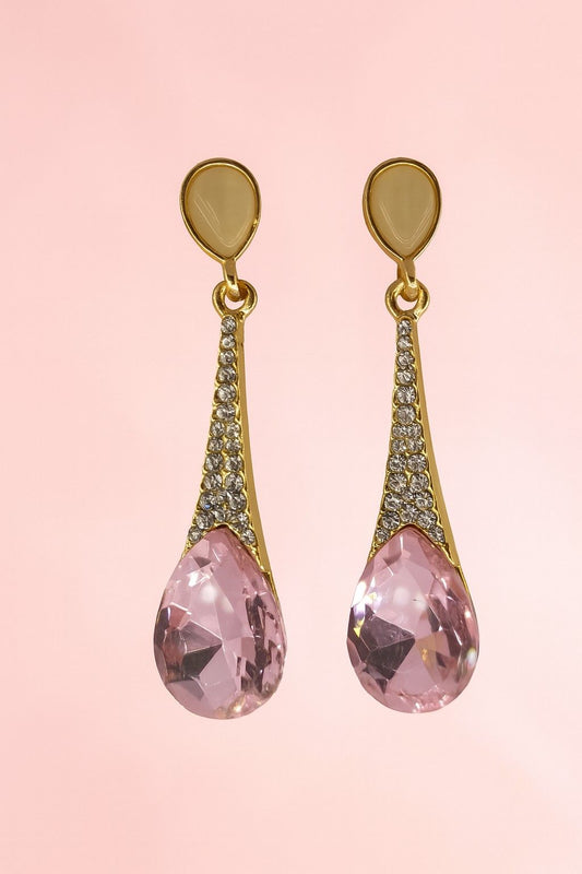 Gold-tone teardrop pink crystal dangle earrings – front view on plain background