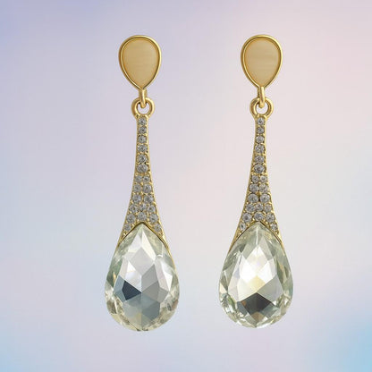 Golden finish drop earrings with clear teardrop crystal and cubic zirconia accents – front view