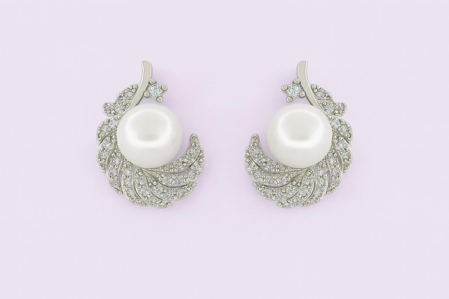"Silver-tone feather pearl stud earrings with crystals"