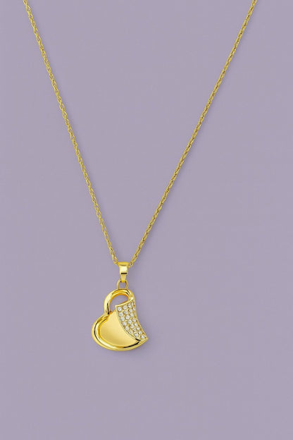 Gold-tone heart pendant necklace with sparkling crystals on a chain – product close-up