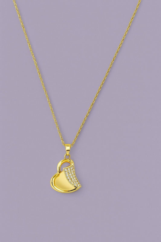 Gold-tone heart pendant necklace with sparkling crystals on a chain – product close-up