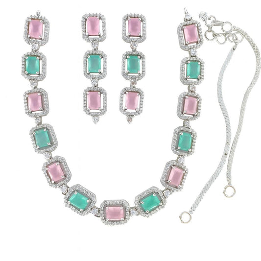 Pink and green American Diamond necklace set with earrings in silver-tone finish on white background

