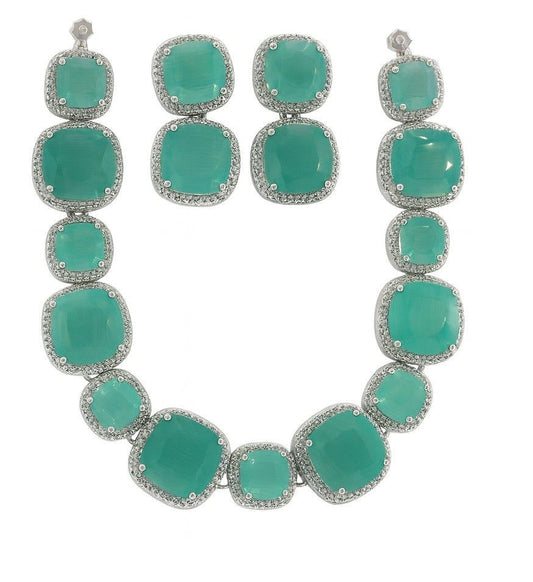 Elegant green stone necklace and earrings set with American Diamonds in silver finish

