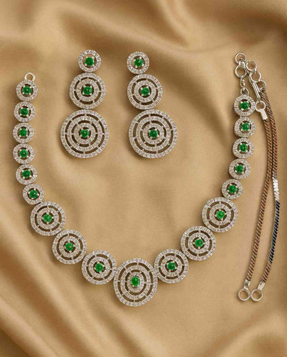 Green Stone & American Diamond Circle Necklace Set on golden fabric background