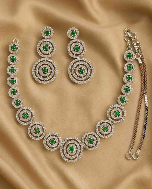 Green Stone & American Diamond Circle Necklace Set on golden fabric background
